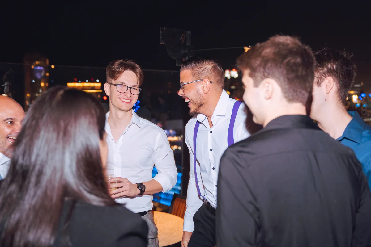 LeadUp founder Franco Maccarone speaking with a group at an event